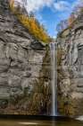 USA, New York. Fall foliage and Taughannock Falls at State Park Art Print